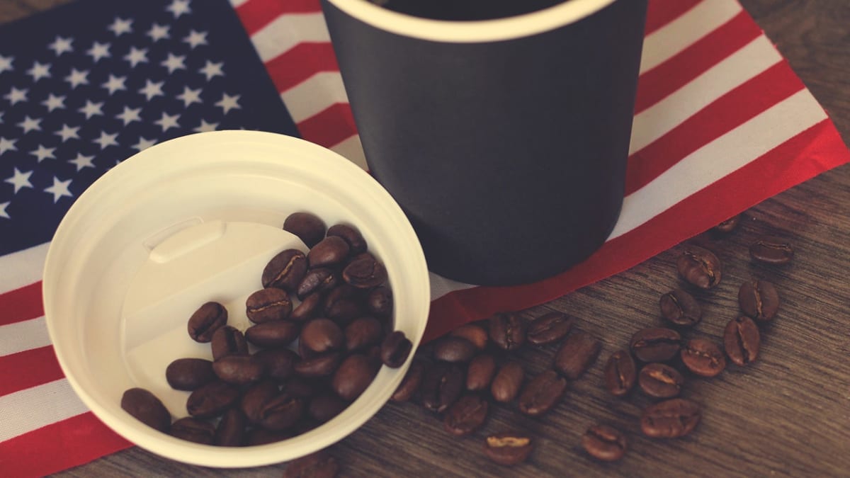 Variety of veteran-owned coffee bags and hot sauce bottles displayed on American flag background