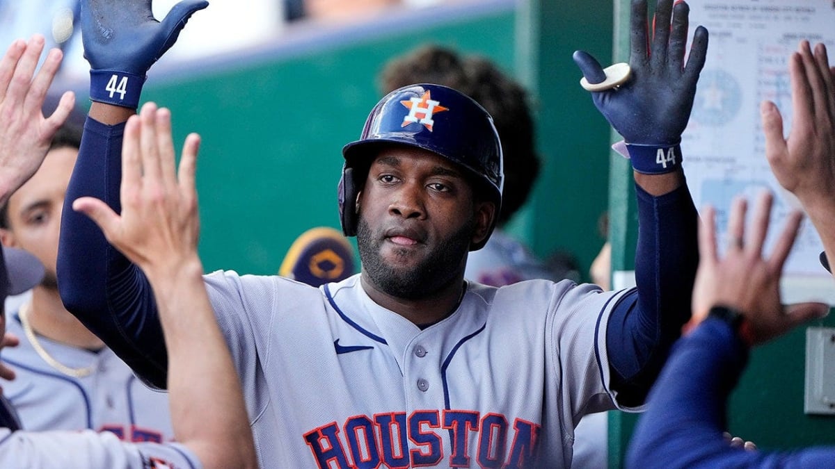Yordan Álvarez celebrating in Houston Astros dugout after hitting home run against Kansas City