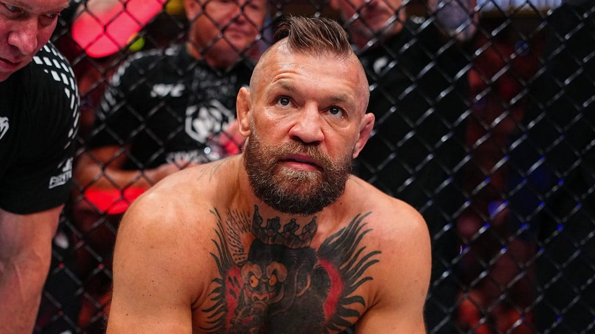 Conor McGregor in recovery after successful ACL surgery, determined and smiling