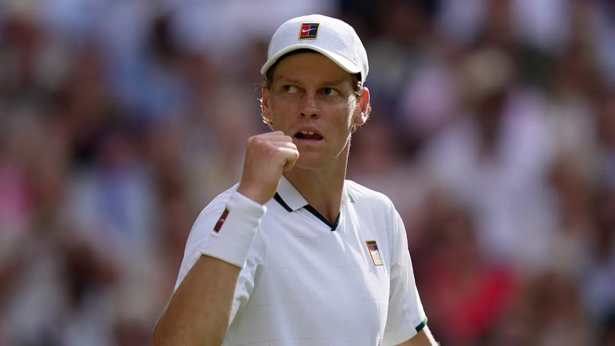 Jannik Sinner celebrates winning a point during Wimbledon semifinal match against Novak Djokovic