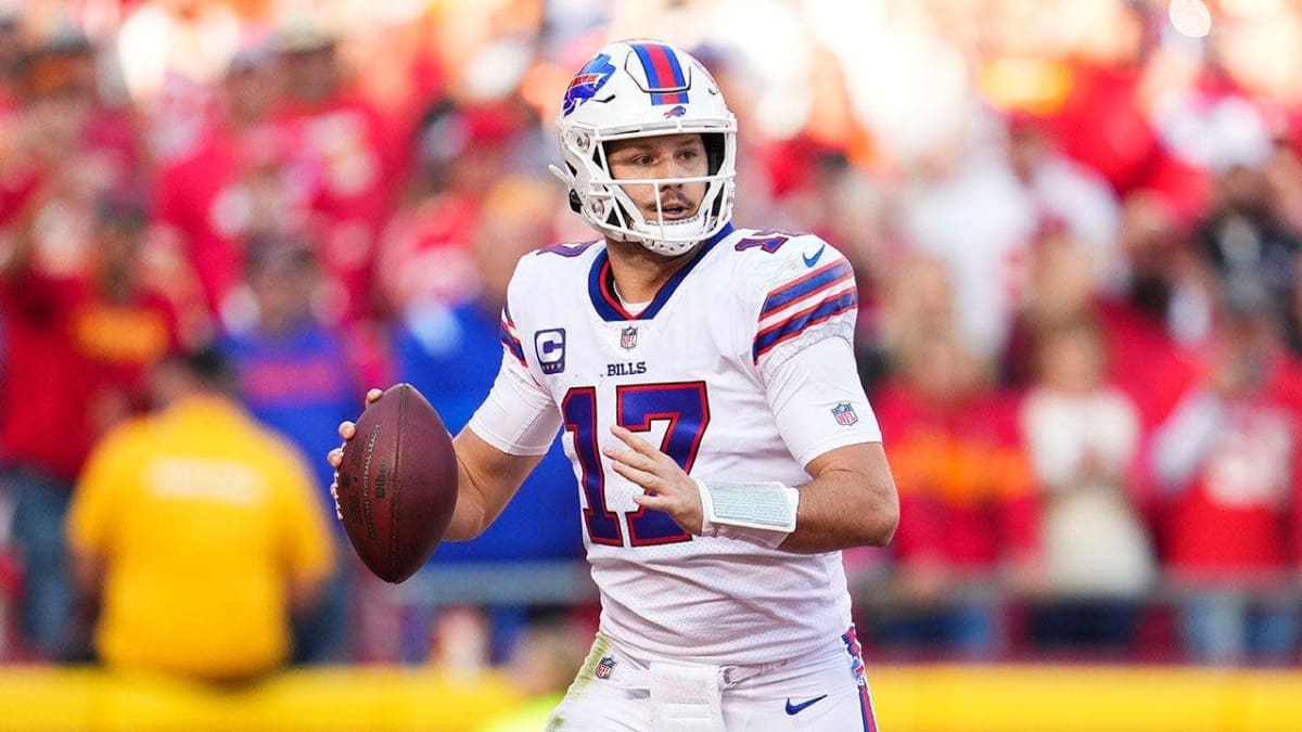 Buffalo Bills quarterback Josh Allen throwing a pass during an NFL game in stadium