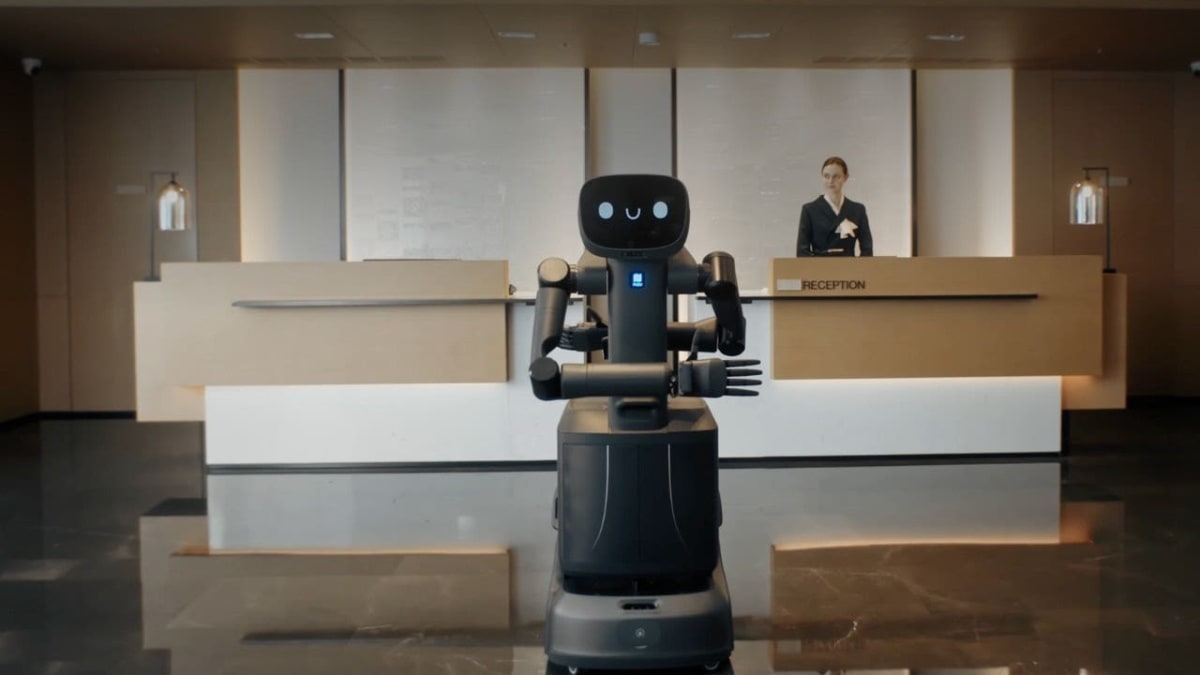 Modern robots in hotel lobby providing check-in and guest services in Shenzhen China facility
