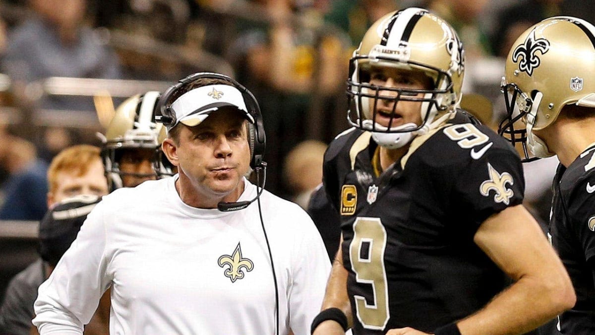Sean Payton and Drew Brees talking on sideline during New Orleans Saints game