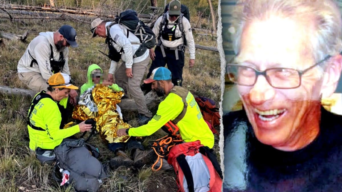 Search and rescue team carrying elderly hiker through rugged Grand Canyon terrain on stretcher