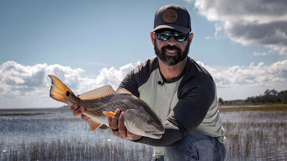 Charter captain Jonathan Moss fishing with his two young sons on Florida waters