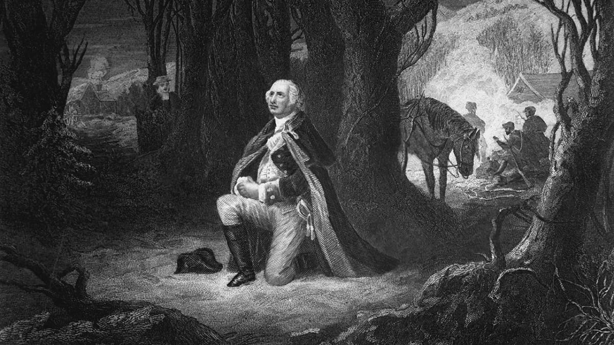 Historical painting depicting General George Washington kneeling in prayer at Valley Forge during winter