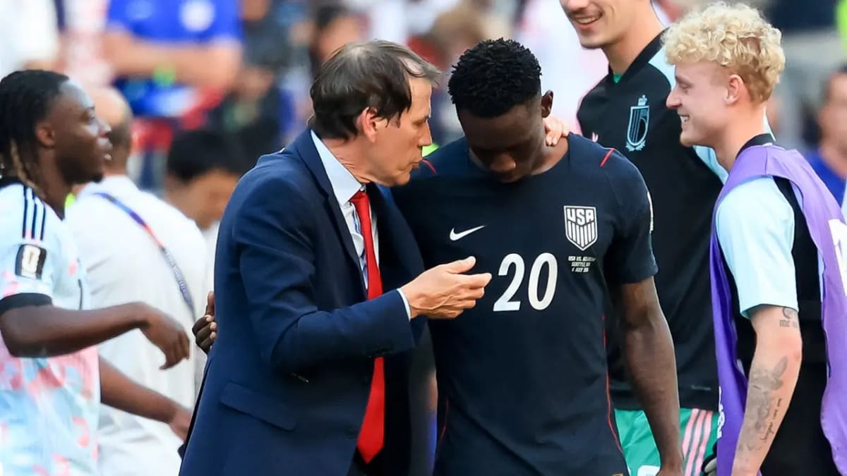U.S. soccer player Folarin Balogun speaking with Belgium coach Rudi Garcia after World Cup match