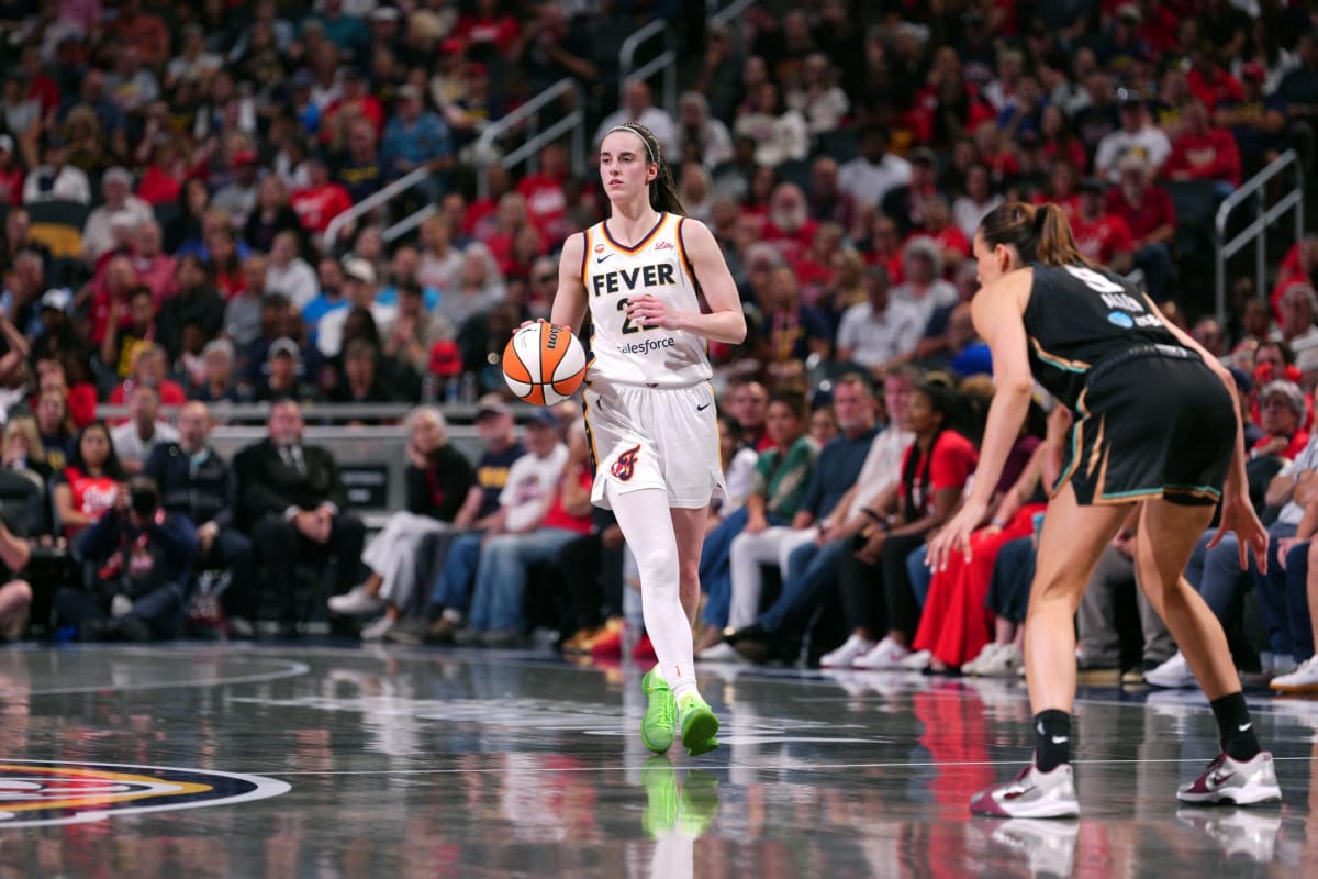 Caitlin Clark shoots basketball during Indiana Fever game against New York Liberty at Gainbridge Fieldhouse