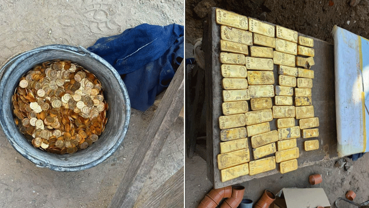 Gold coins and bars laid out on ground after discovery by Belgian construction workers