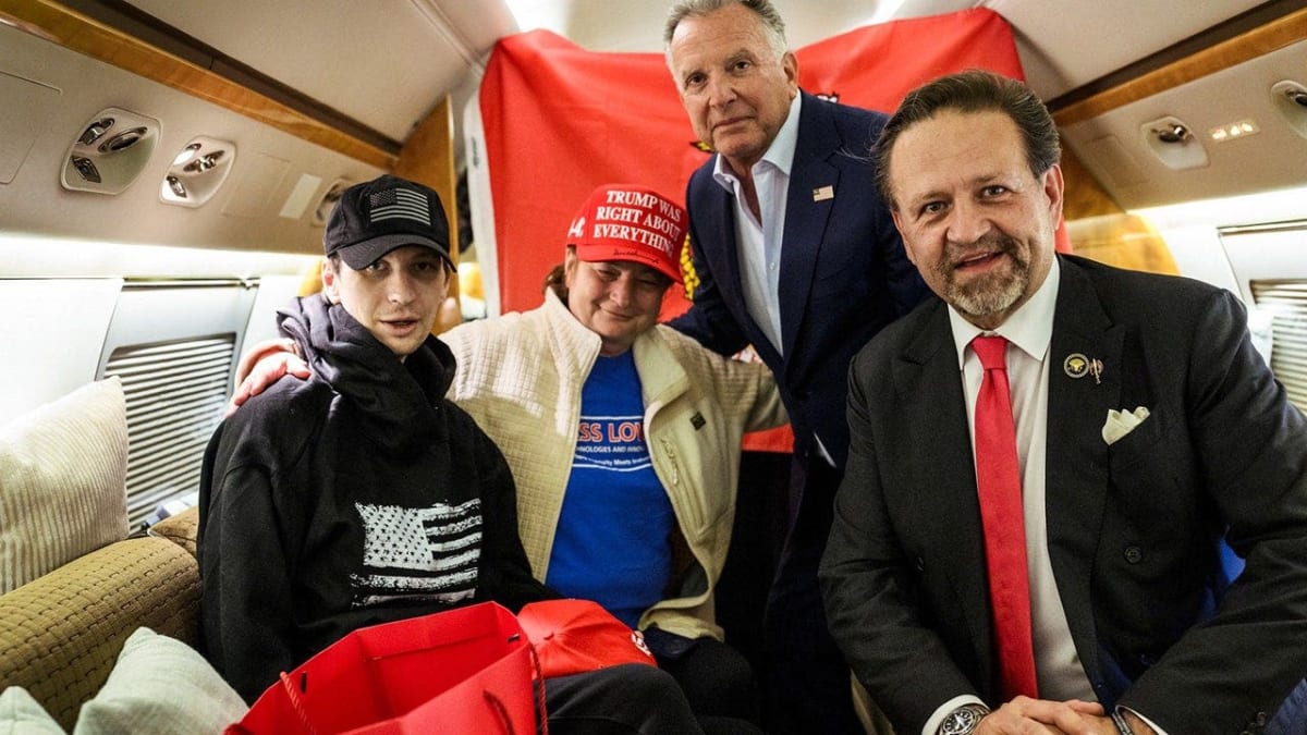 Marine veteran Robert Gilman reunites with officials on airplane tarmac after Russian release