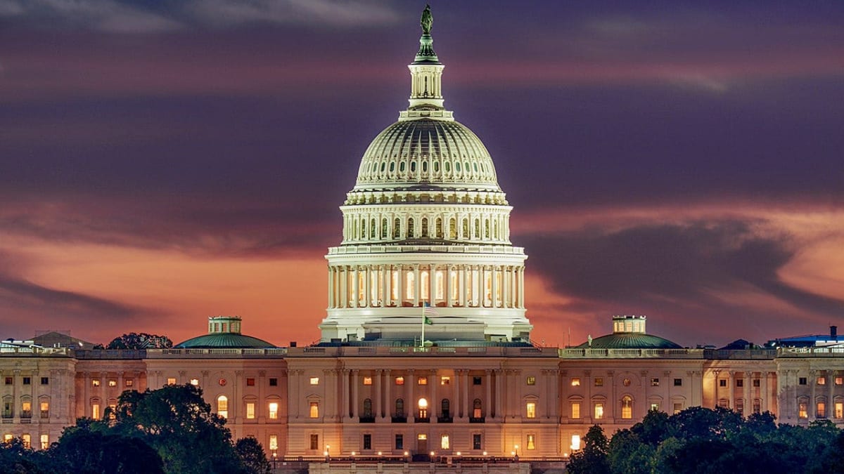 The United States Capitol building dome against blue sky in Washington DC