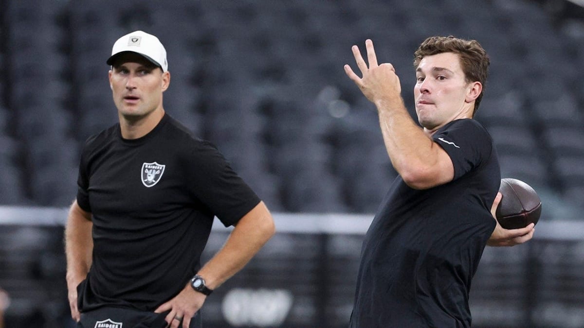 ** Kirk Cousins and Fernando Mendoza warming up together on Las Vegas Raiders practice field