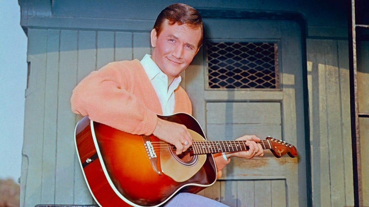 Country music legend Roger Miller smiling in vintage photograph from his Grammy-winning career era