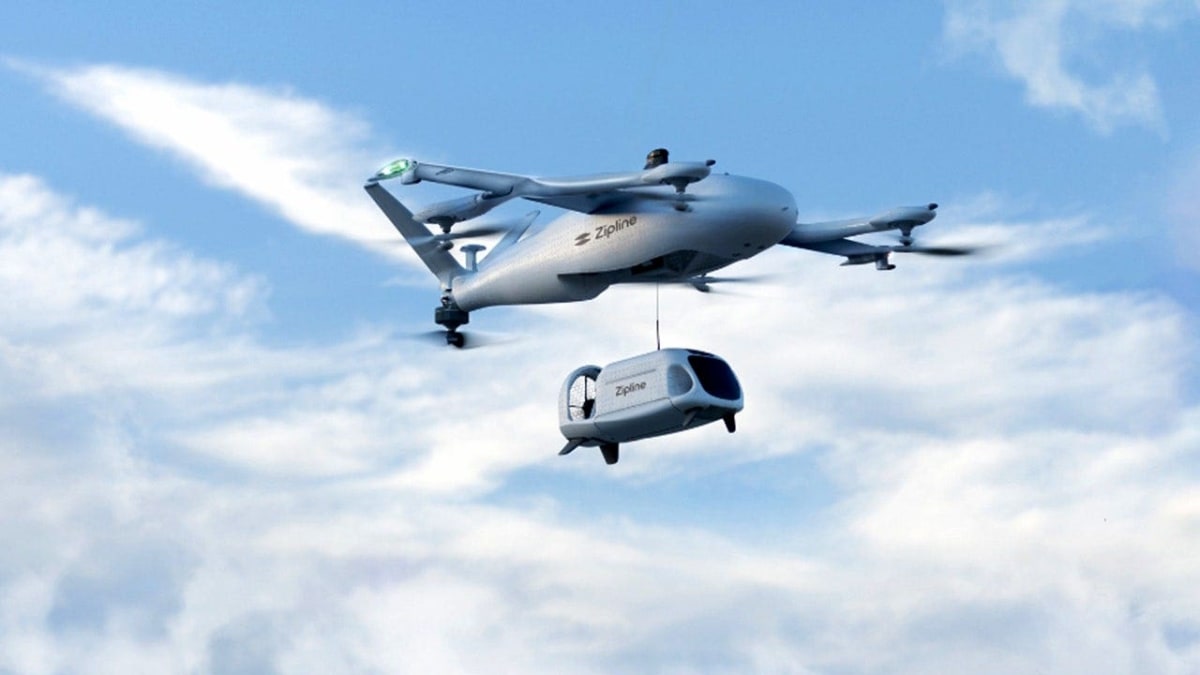 Zipline autonomous drone hovering above Cleveland Clinic patient's home delivering prescription medication by tether