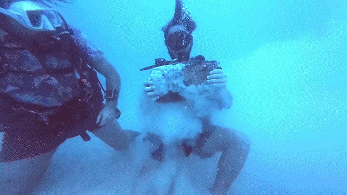 Heavily encrusted 55-pound copper ingot recovered from 400-year-old Spanish shipwreck off Florida coast