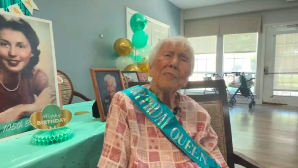 Blynda Vidock smiling at her 105th birthday celebration surrounded by family and friends in Texas