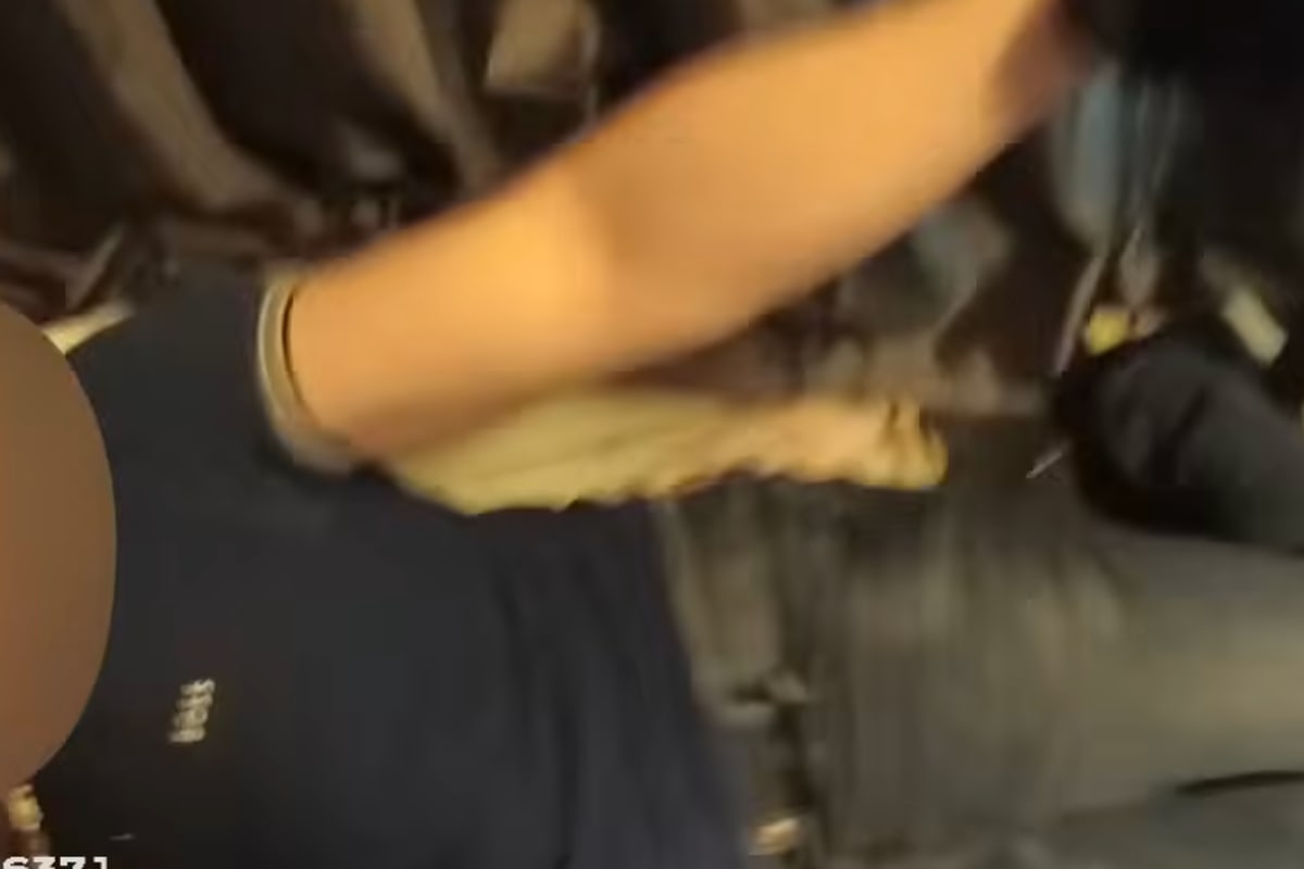 Police bodycam footage shows suspect asleep in small child's floor bed in Newark home