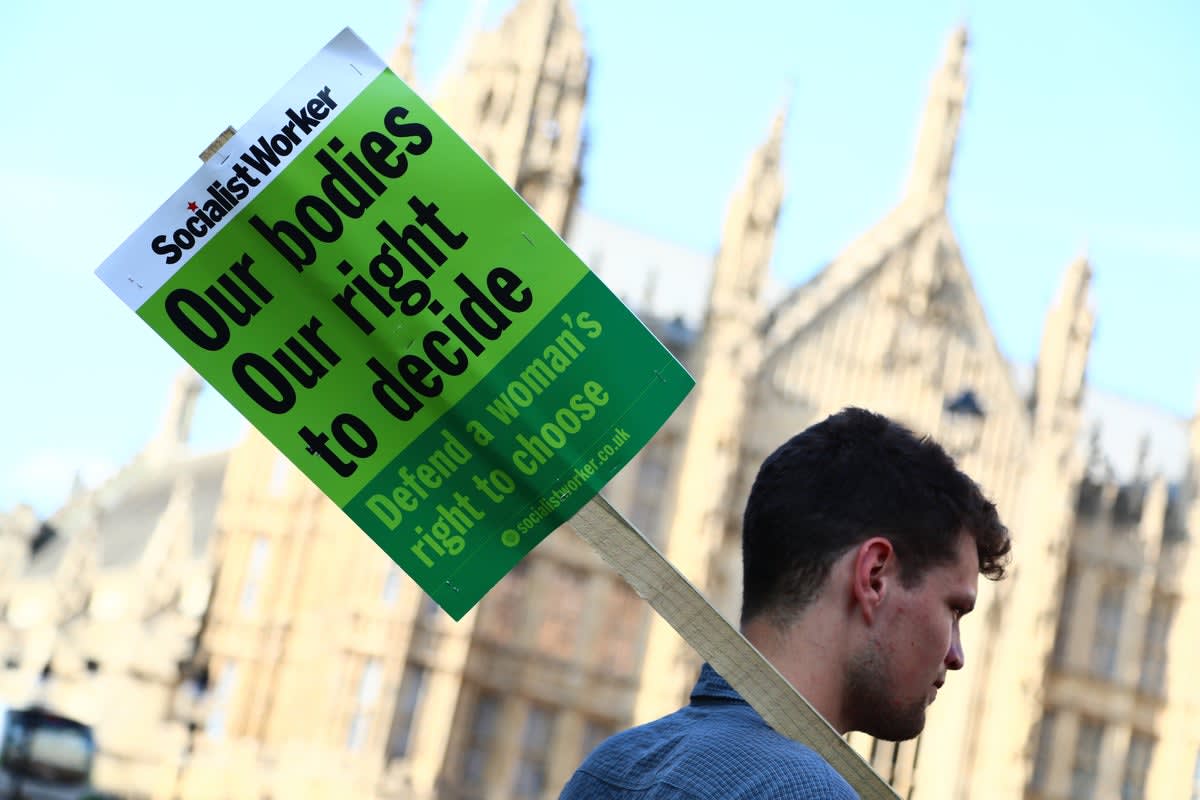 Pro-choice protesters gather outside UK Parliament during historic abortion decriminalization vote in 2025