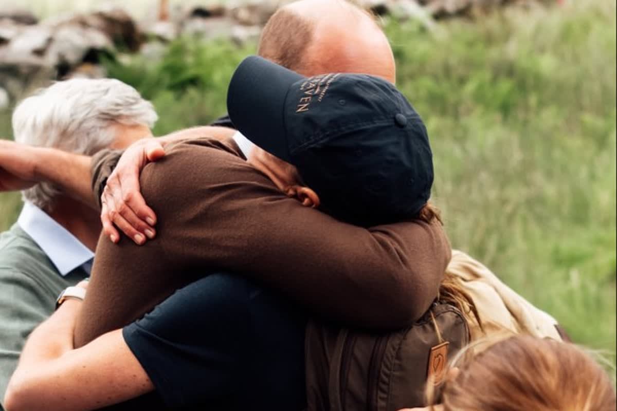 ** Princess Kate embracing Prince William and her children after completing Three Peaks Challenge at Snowdon