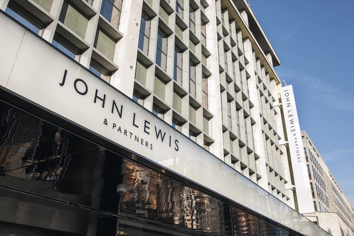 John Lewis and Waitrose store fronts with "Now Hiring" seasonal employment signage displayed