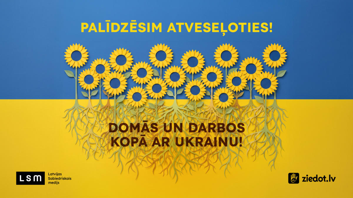 ** Latvian Public Media building with Ukraine solidarity campaign banner displayed prominently outside