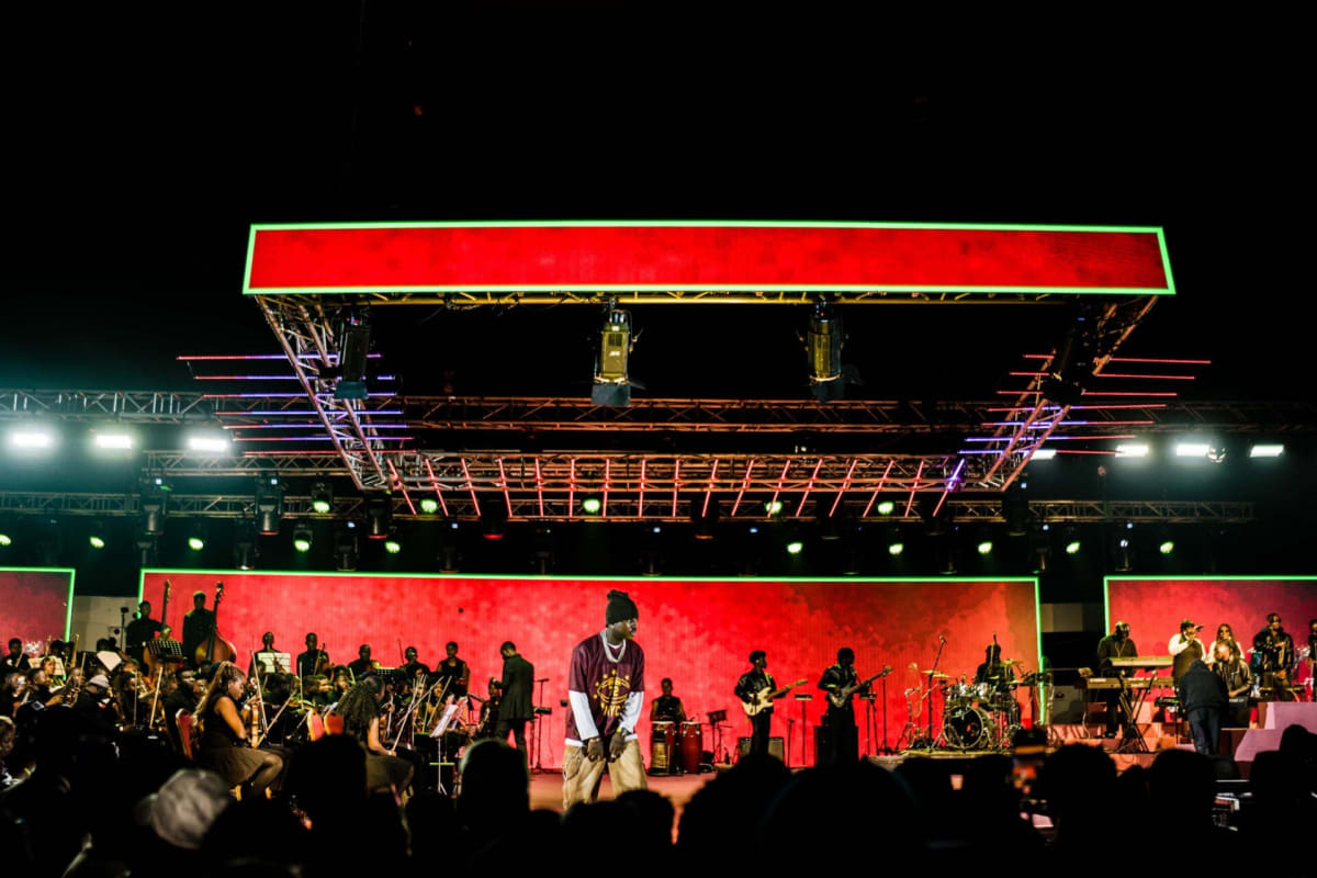 Large orchestra performing on stage at Afrobeats concert in Lagos, Nigeria