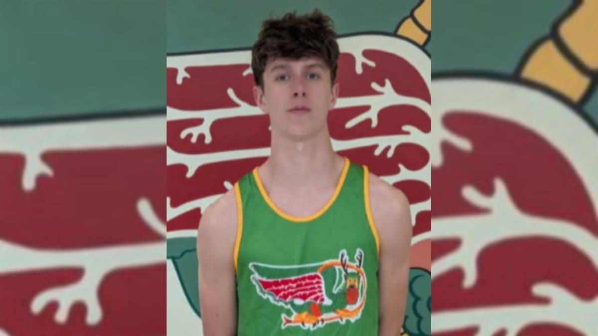 ** High school track athlete Thor Springman competing in race at Southwestern High School