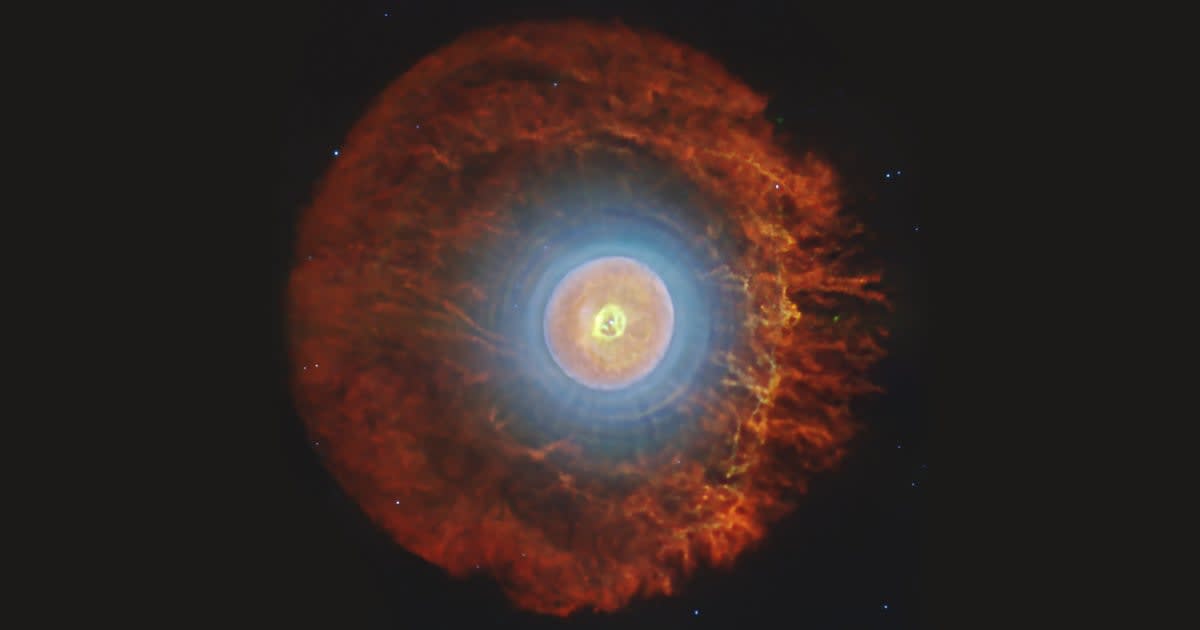 James Webb Telescope infrared image showing planetary nebula Tc 1 with blue hot gas and red cooler gas