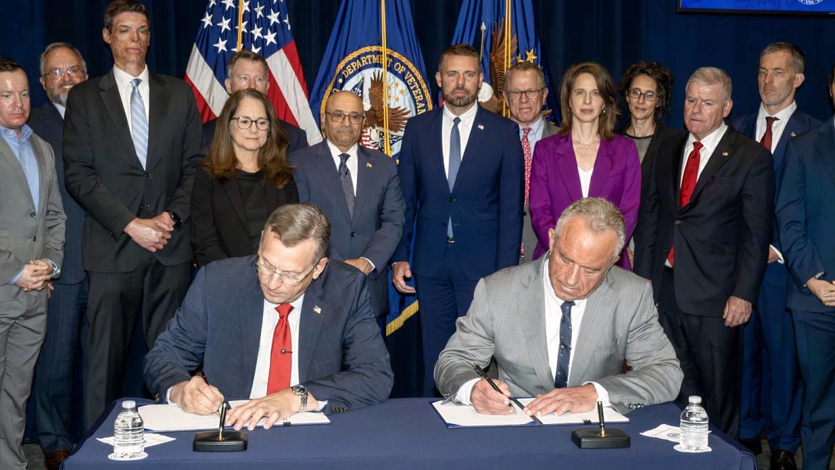 VA Secretary Doug Collins and HHS Secretary Robert F. Kennedy Jr. signing partnership agreement at VA headquarters