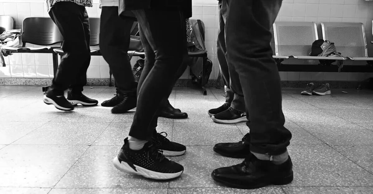 Parkinson's patients and partners dancing tango together at Buenos Aires hospital therapy session