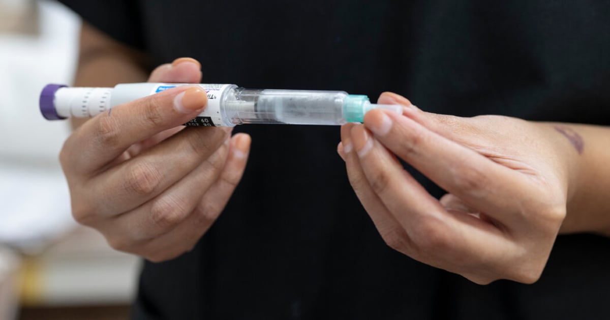 Healthcare worker preparing semaglutide injection at medical center in New Delhi, India