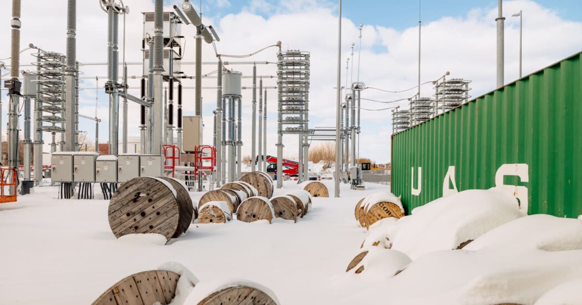 Futuristic electrical converter station in Queens with massive metallic equipment structures
