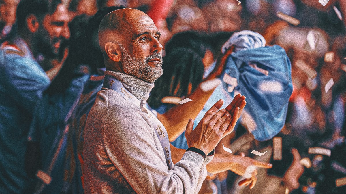 Pep Guardiola standing at Etihad Stadium with Manchester City fans celebrating in background