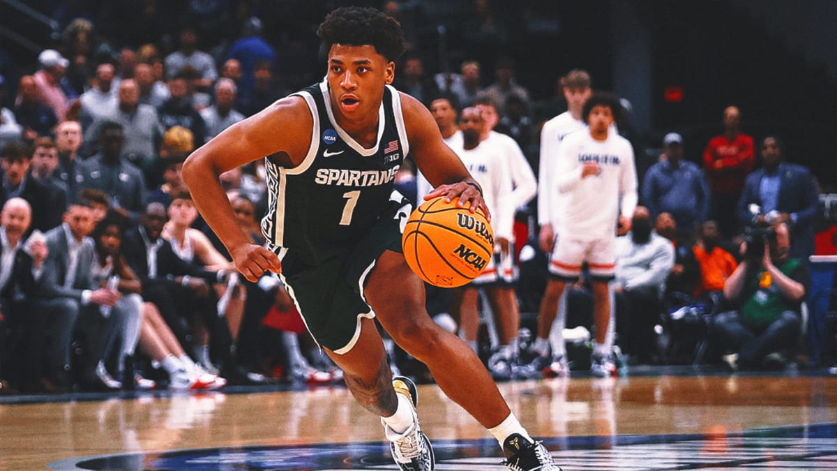 Michigan State point guard Jeremy Fears Jr. dribbling basketball during college game in green jersey