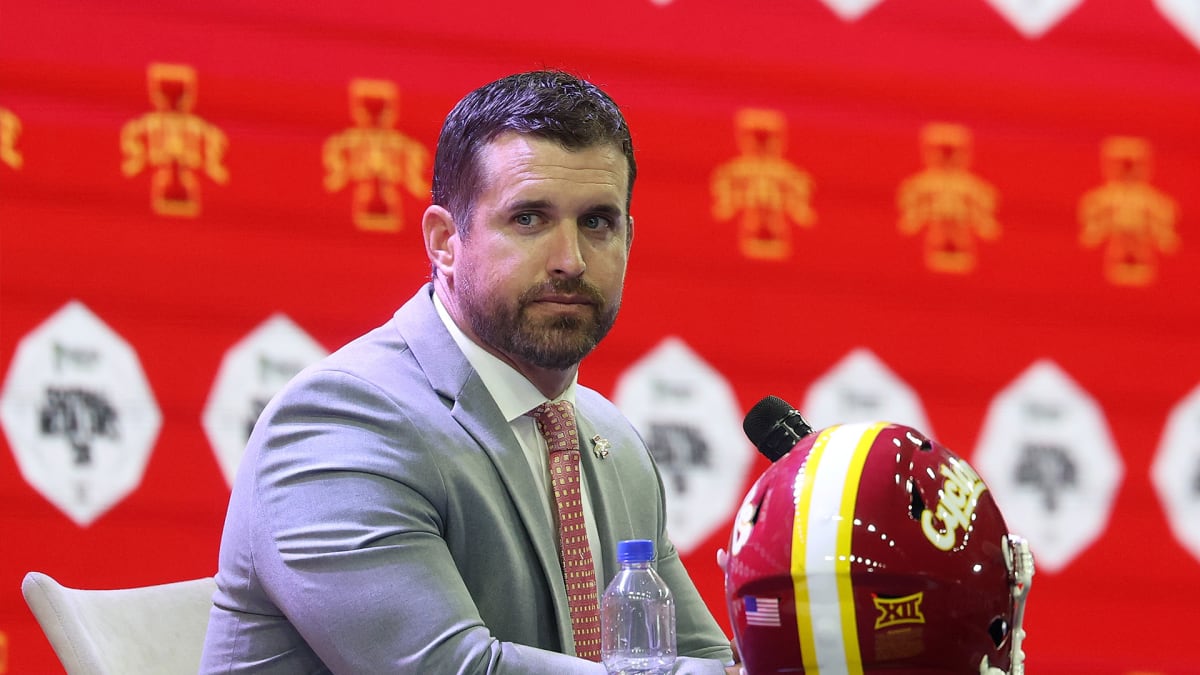 Iowa State football coach Jimmy Rogers speaking confidently at press conference in Ames