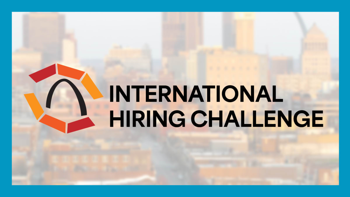 Diverse group of international professionals and students collaborating in St. Louis workplace