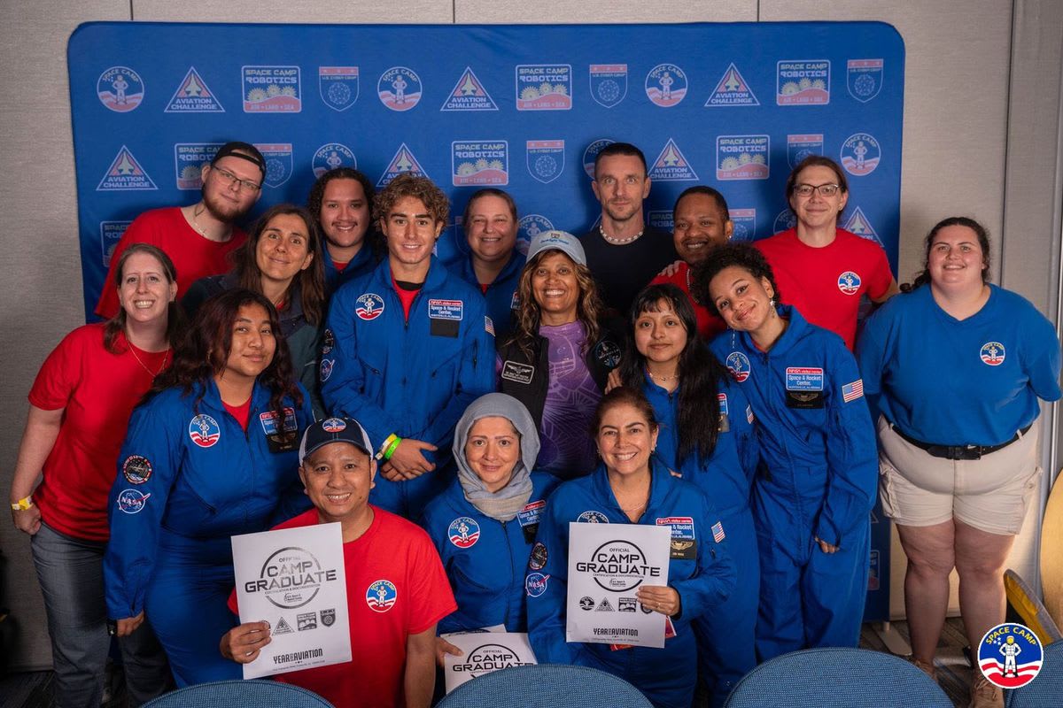 Five diverse Santa Monica College students in space simulation training at Alabama Space Camp facility