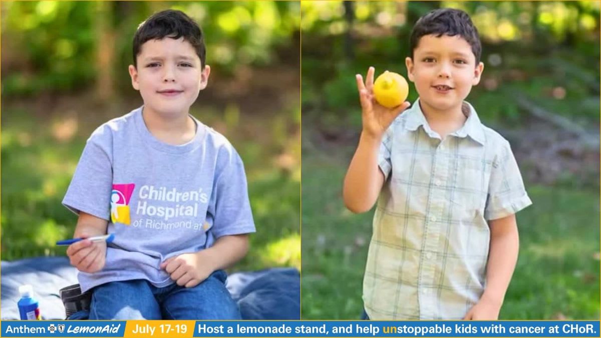 Young boy John smiling after ringing ceremonial bell marking end of cancer treatment