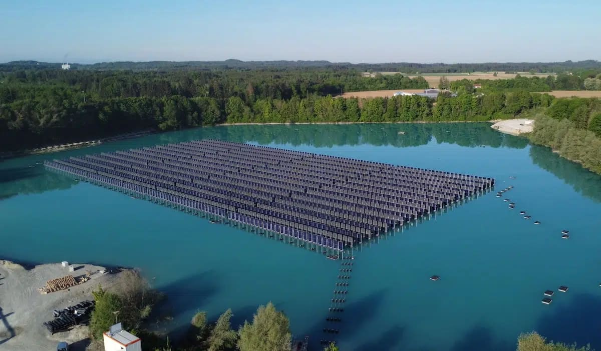 Vertical solar panels floating on lake surface in Germany arranged east to west