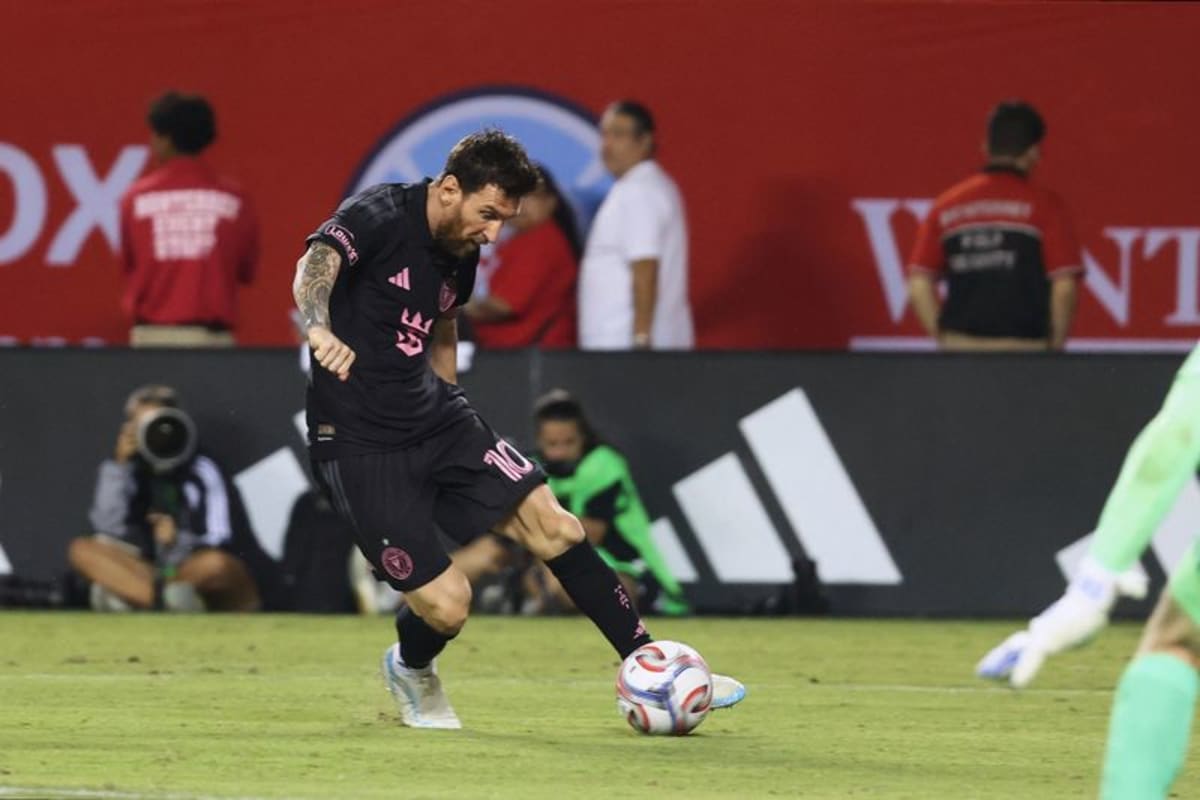 Lionel Messi in Inter Miami pink jersey celebrating his 100th club goal at Nu Stadium
