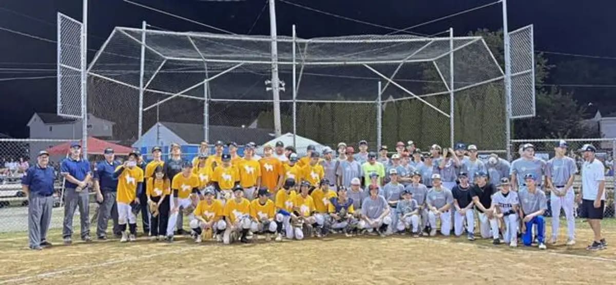 ** Youth baseball players from USA and World all-star teams pose together at Freeport tournament
