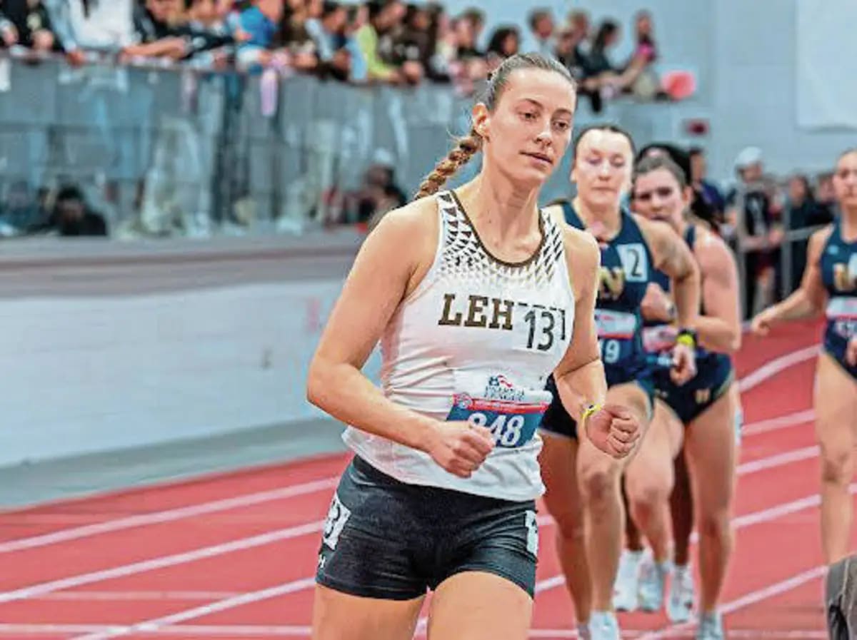 Corinn Brewer competing in track and field event at outdoor stadium championship