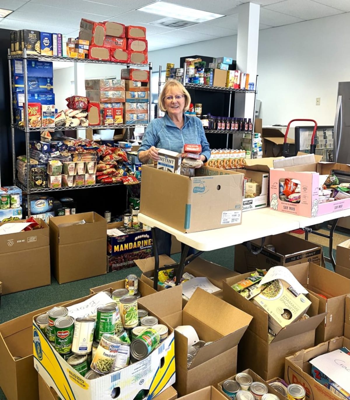 ** Volunteers work together building affordable homes at Habitat for Humanity construction site in Gypsum Colorado