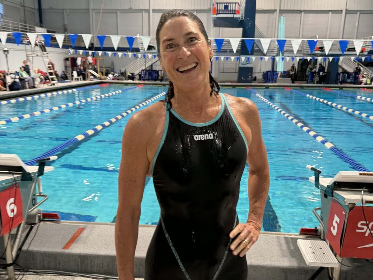 Mary Meagher swimming butterfly stroke during masters competition in Georgia pool