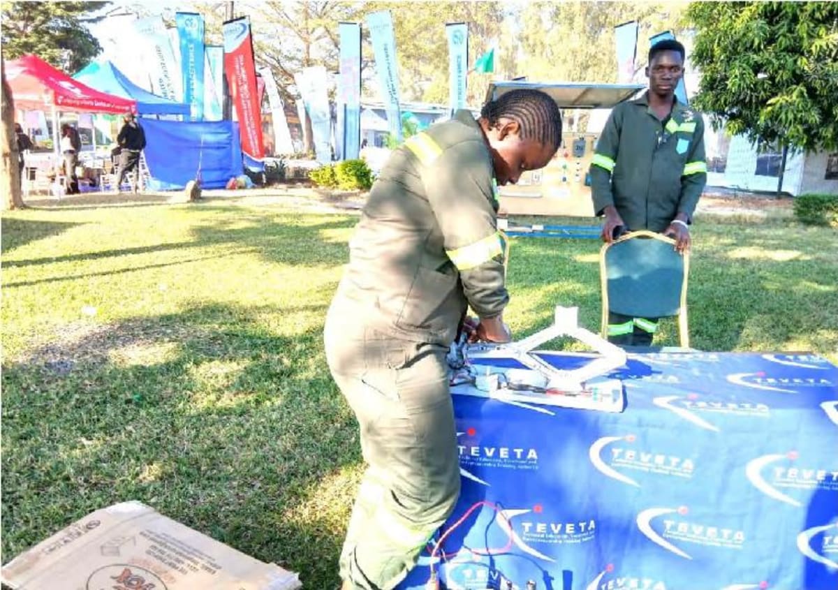 Northern Technical College student demonstrates her innovative electrically operated car jack invention in Zambia