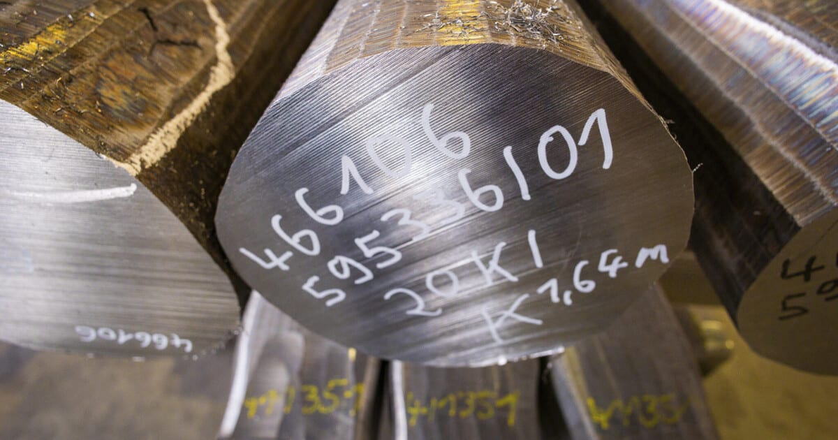 ** Steel manufacturing facility with industrial equipment, representing European carbon border policy impact on imports