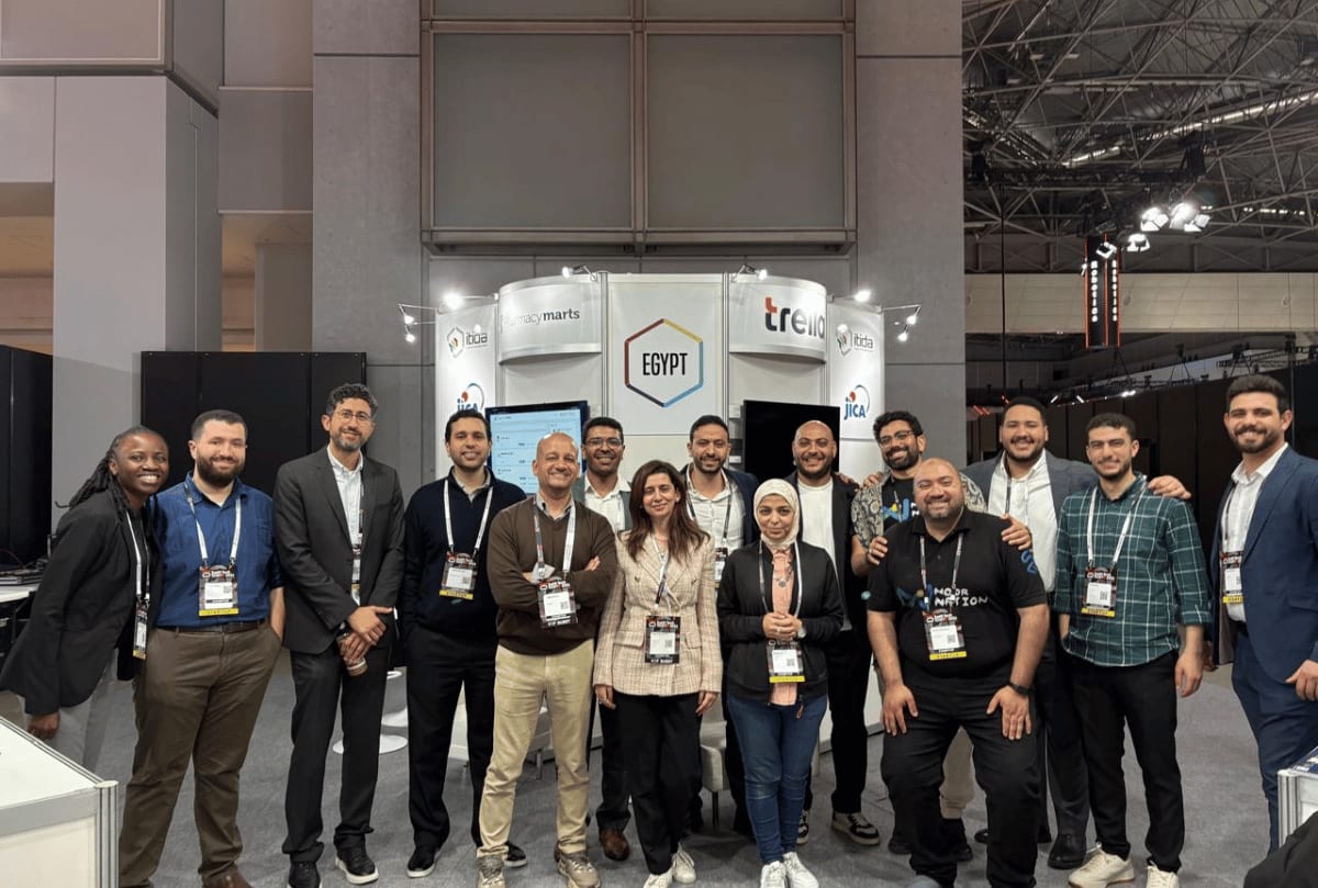 Egyptian tech entrepreneurs presenting innovative startup solutions at modern exhibition pavilion in Tokyo