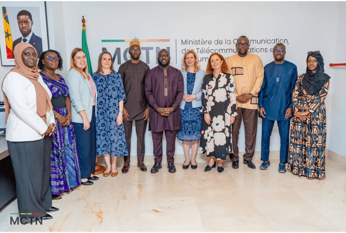 Finnish and Senegalese officials shaking hands during digital partnership signing ceremony in Dakar