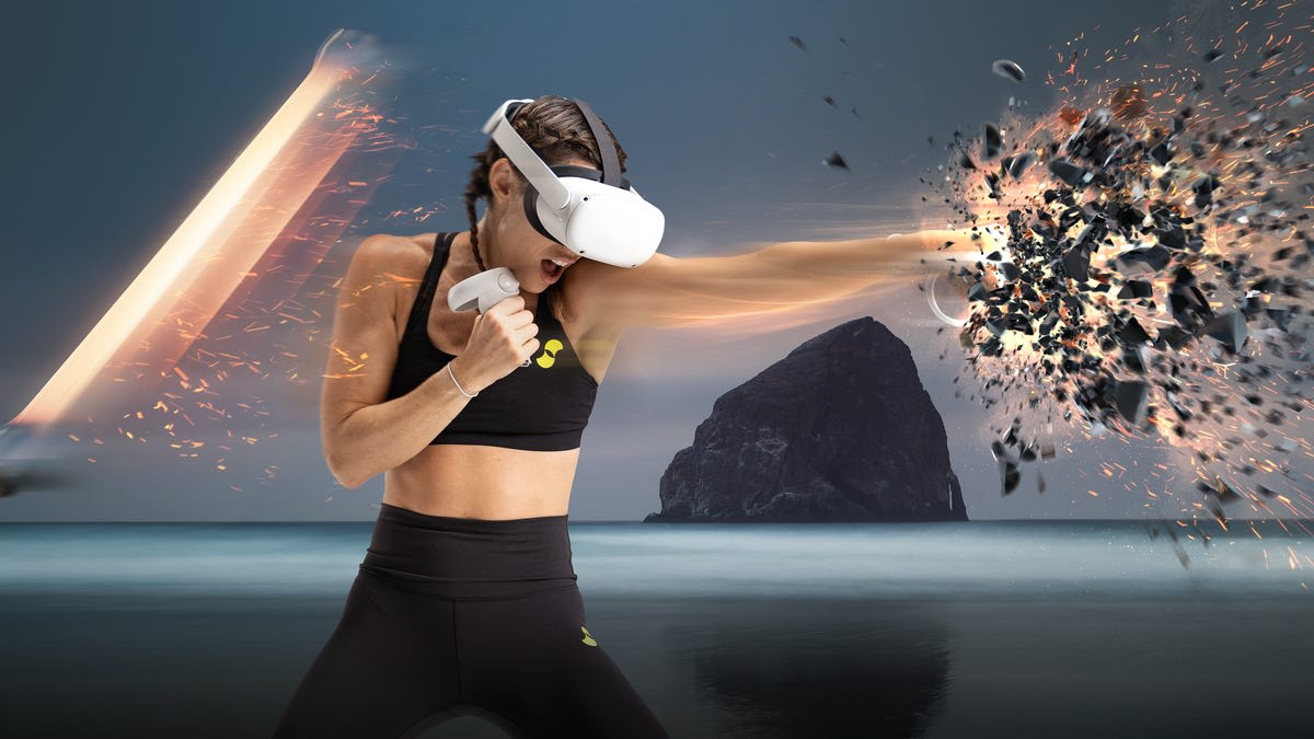 Person wearing VR headset doing energetic workout movements in bright virtual environment