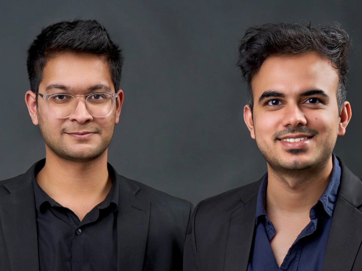 Triomics co-founders Sarim Khan and Hrituraj Singh standing together in professional setting